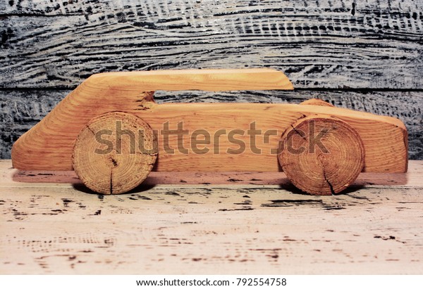 wooden car on a wooden
background