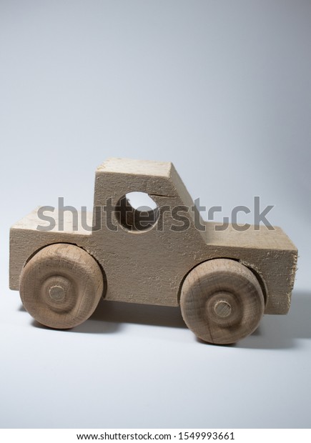 wooden car on a white\
background