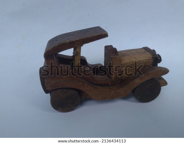 Wooden car\
side view isolated on white\
background.
