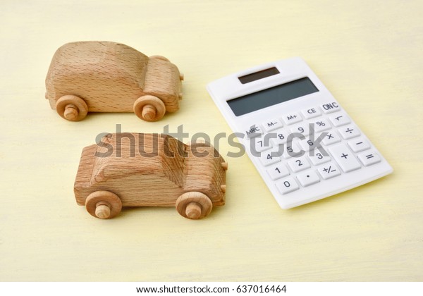 Wooden cars\
and calculator - Image of car\
purchase\
