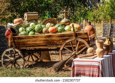 Wooden cart with the harvest. Autumn Harvest Festival - old cart with watermelons, cabbage, pumpkins and ash. - Shutterstock ID 2182307737