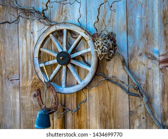 Wooden Cartwheel Decoration On The Barn Door