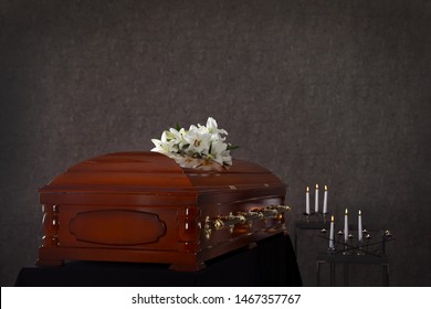 Wooden casket with white lilies in funeral home - Shutterstock ID 1467357767