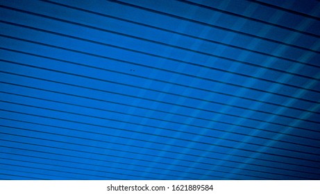 A wooden ceiling and reflective shades in blue tint 