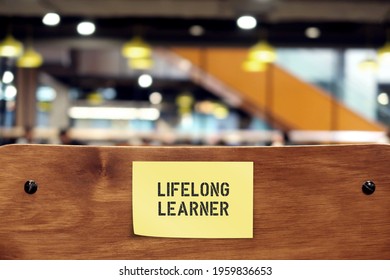 Wooden Chair Back With Note Sticking LIFELONG LEARNER, Refers To Those Who Gain Knowledge By Learning New Skills Throughout Life- Continue Education For Personal Development Or Fulfillment