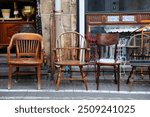 Wooden chairs and other furniture in antique shop in Jaffa district of Tel Aviv, Israel.