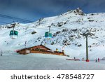 Wooden chalet and ski slopes with cable car in the French Alps,Les 3 Vallees,Menuires,France,Europe