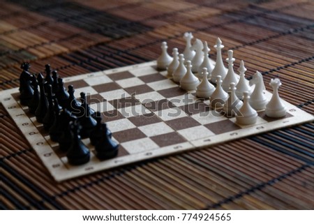 Wooden Chess Board and steel chess pieces, isolated on board