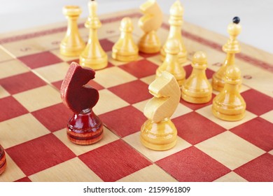 Wooden Chess Figures On The Board During The Game Close Up.