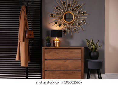 Wooden Chest Of Drawers With Decor, Coat Stand And Mirror In Hallway. Interior Design