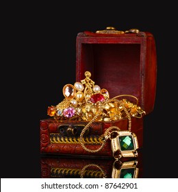 Wooden Chest Full Of Gold Jewelry On Black Background