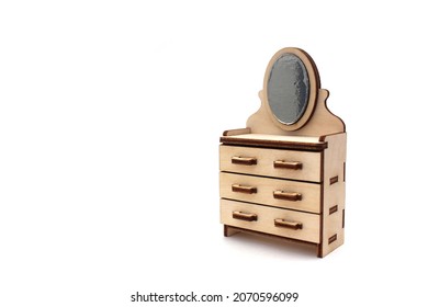 Wooden Children's Toy Chest Of Drawers With A Mirror Assembled From Plywood On A White Isolated Background.