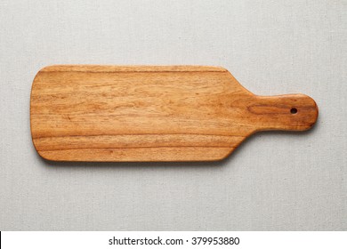 Wooden Chopping Board On The Linen