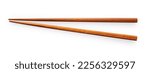 Wooden chopsticks placed on a white background. Viewed from above.