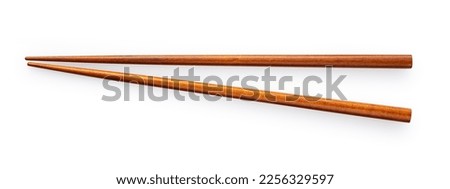 Wooden chopsticks placed on a white background. Viewed from above.