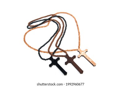 Wooden Christian Cross Necklace Isolated On White Background.