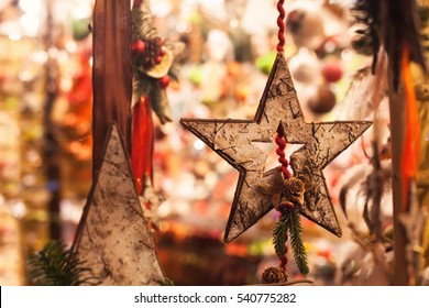 wooden christmas star decoration close up in the street market