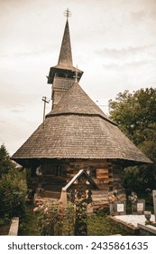 The Wooden Churches of Surdesti in Maramures was built with high timber, and its characteristic features are the tall and slim bell towers located at the western end of the building. and massive roof.