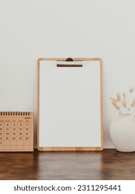 Wooden clipboard with blank paper with copy space on white background with decoration. Minimal concept. Advertising board, business template. Top view - Shutterstock ID 2311295441