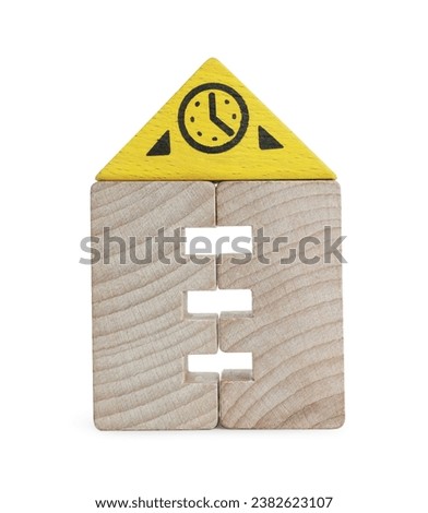 Wooden clock tower made of building blocks isolated on white. Educational toy for motor skills development