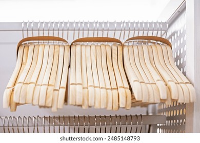 wooden clothes hangers in the interior - Powered by Shutterstock