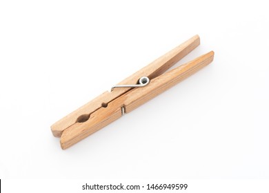 Wooden clothes pin on the white background.