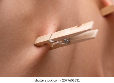 Wooden Clothespin On Skin Man's Back Pain Ache Discomfort Resentment