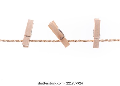 wooden clothespins on a rope