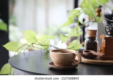 Wooden Coffee Cup Utensil And Plant Pot On Black Table Indoor Drinking