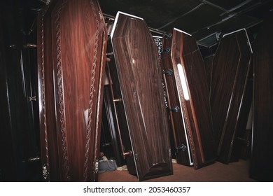 Wooden coffins in the dark room.