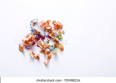 Wooden colored pencil sharpening shavings pile on white isolated background, top view, flat lay, copy space - Powered by Shutterstock