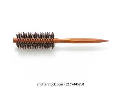 Wooden comb isolated on white background. Comb hair. Wooden comb material. Product design. Woman's comb. Accessory. Hair style. Hair brush.