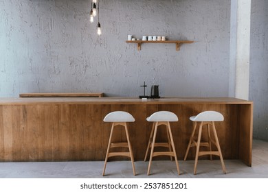 Wooden counter or bar and wooden shelves on a rough cement wall. Coffee shop or home decoration. Modern style decoration. - Powered by Shutterstock