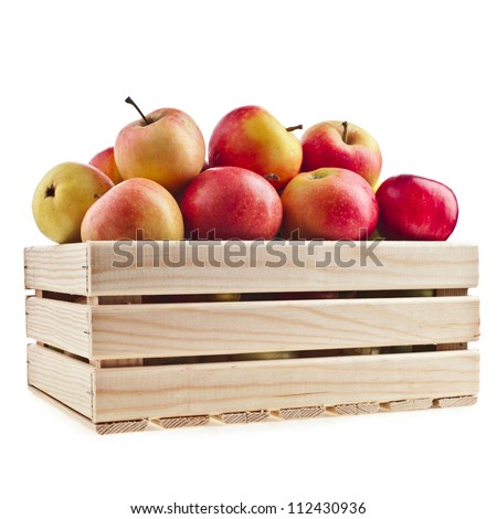 Wooden crate box full of fresh apples isolated on a white background