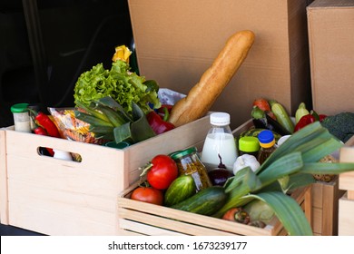 Wooden Crates With Fresh Products In Car Trunk. Food Delivery Service