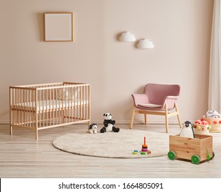 Wooden crib and bed for baby room, pink chair, carpet and frame on the wall. - Powered by Shutterstock