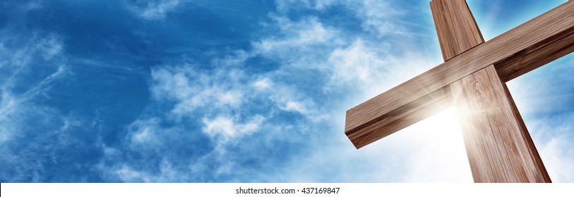 Wooden Cross With A Bright Blue Sky And Sun