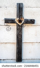 Wooden Cross With Heart On A Wall