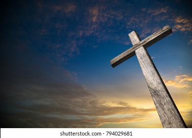 Wooden cross illuminated with a beautiful sunset carrying a message that there is still hope for humanity.