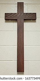 Wooden Cross On A Brick Wall