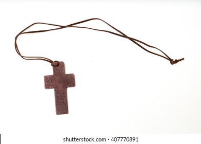 Wooden Cross On Necklace Isolated On White Background.