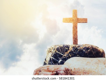 wooden cross on the rock against cloudy sky background - Powered by Shutterstock