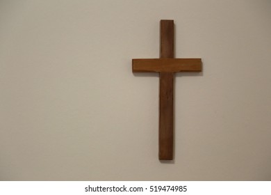 Wooden Cross On White Wall 260nw 519474985 