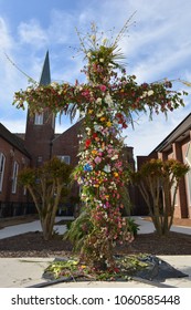 Wooden Cross Outside Decorated With Flowers 