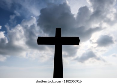 Wooden cross and sky with clouds background. - Shutterstock ID 1182060916