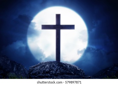 Wooden crosses standing on rock hill with moonlight at night - Shutterstock ID 579897871