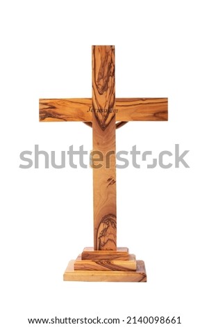 Wooden crucifix back side standing on white background.