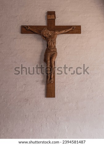 wooden Crucifix on wall in St. Viktor, Xanten, Germany.
