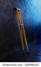 Wooden Crutches On The  Grungy Wall.