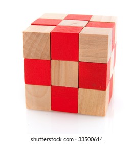 Wooden cuba in red and natural as a puzzle